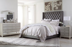 Coralayne California King Upholstered Bed with Mirrored Dresser and Chest - PKG007829