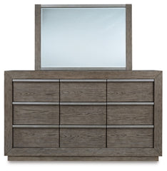 Anibecca Queen Upholstered Panel Bed with Mirrored Dresser, Chest and 2 Nightstands