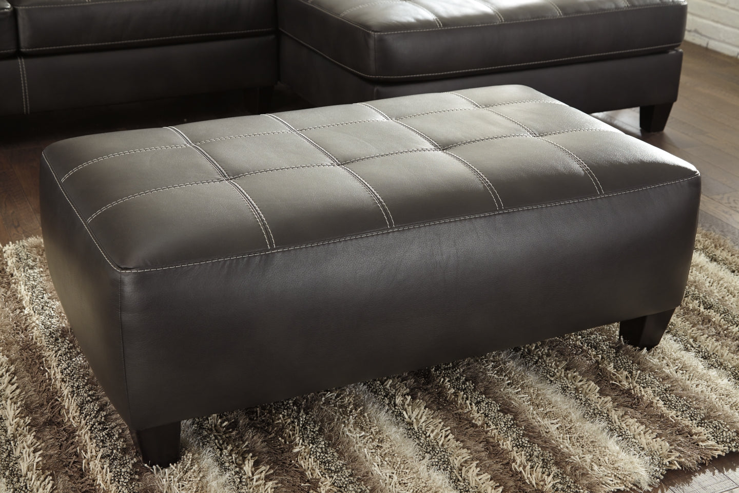 Nokomis 2-Piece Sectional with Ottoman - PKG011026