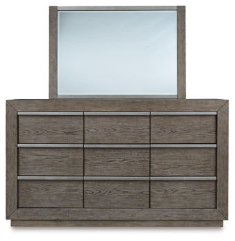 Anibecca Queen Upholstered Panel Bed with Mirrored Dresser and Chest